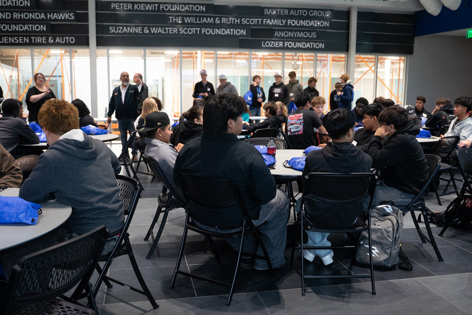 Students gather for an automotive career exploration event.