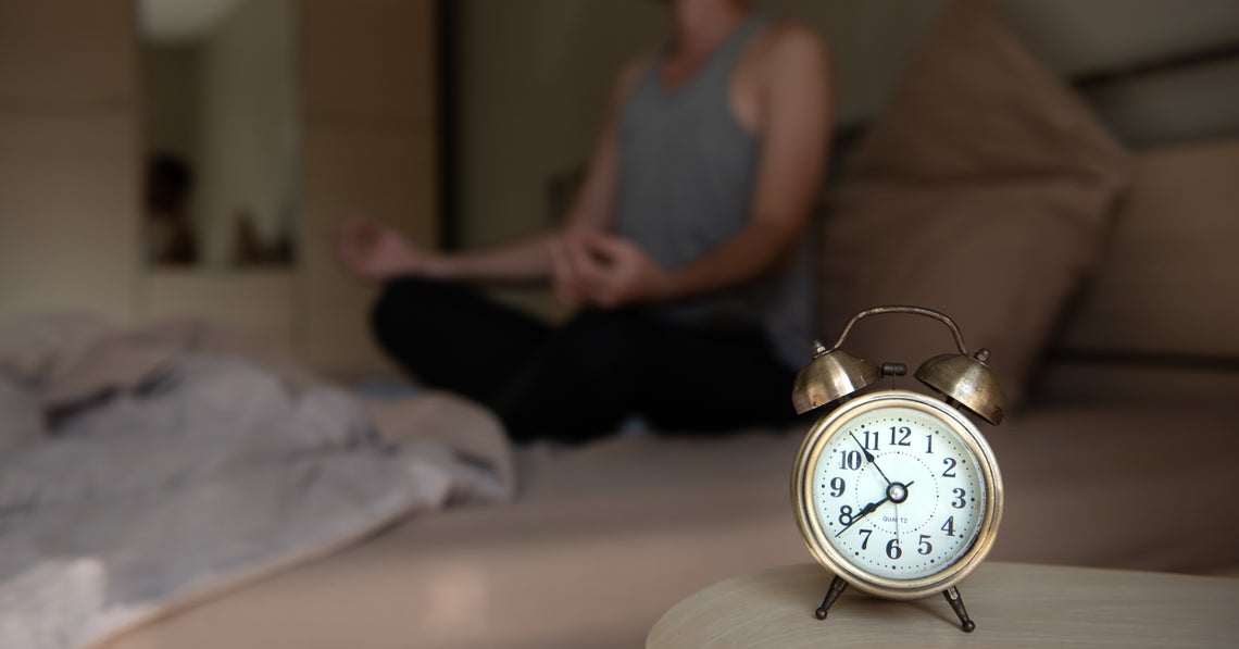 man meditating before going to sleep