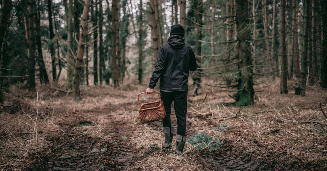 woman out in the forest foraging