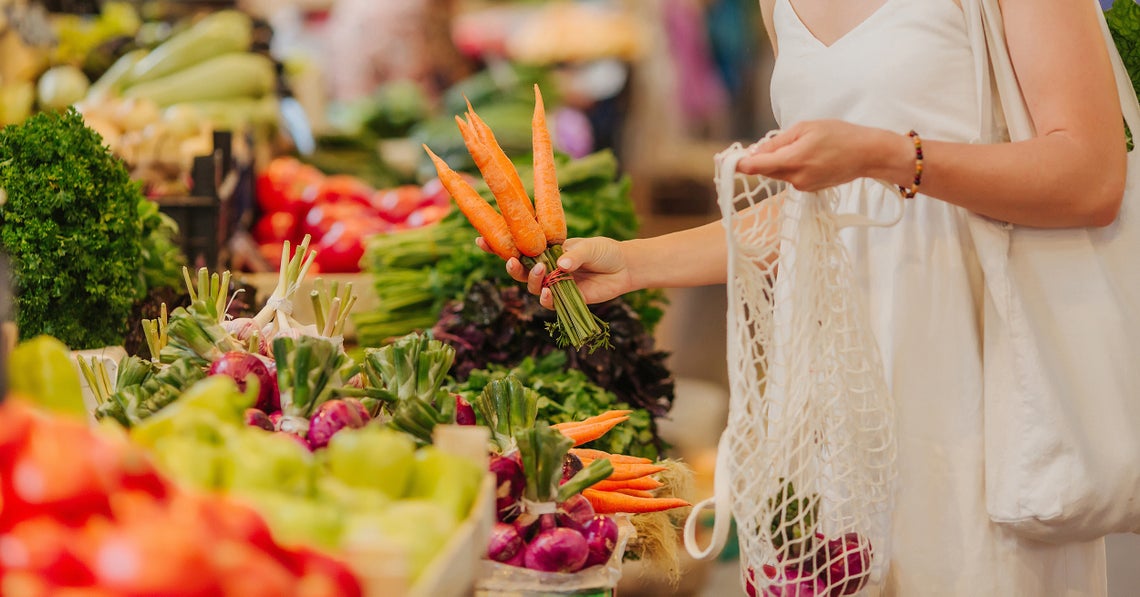 woman shopping with a reusable bag