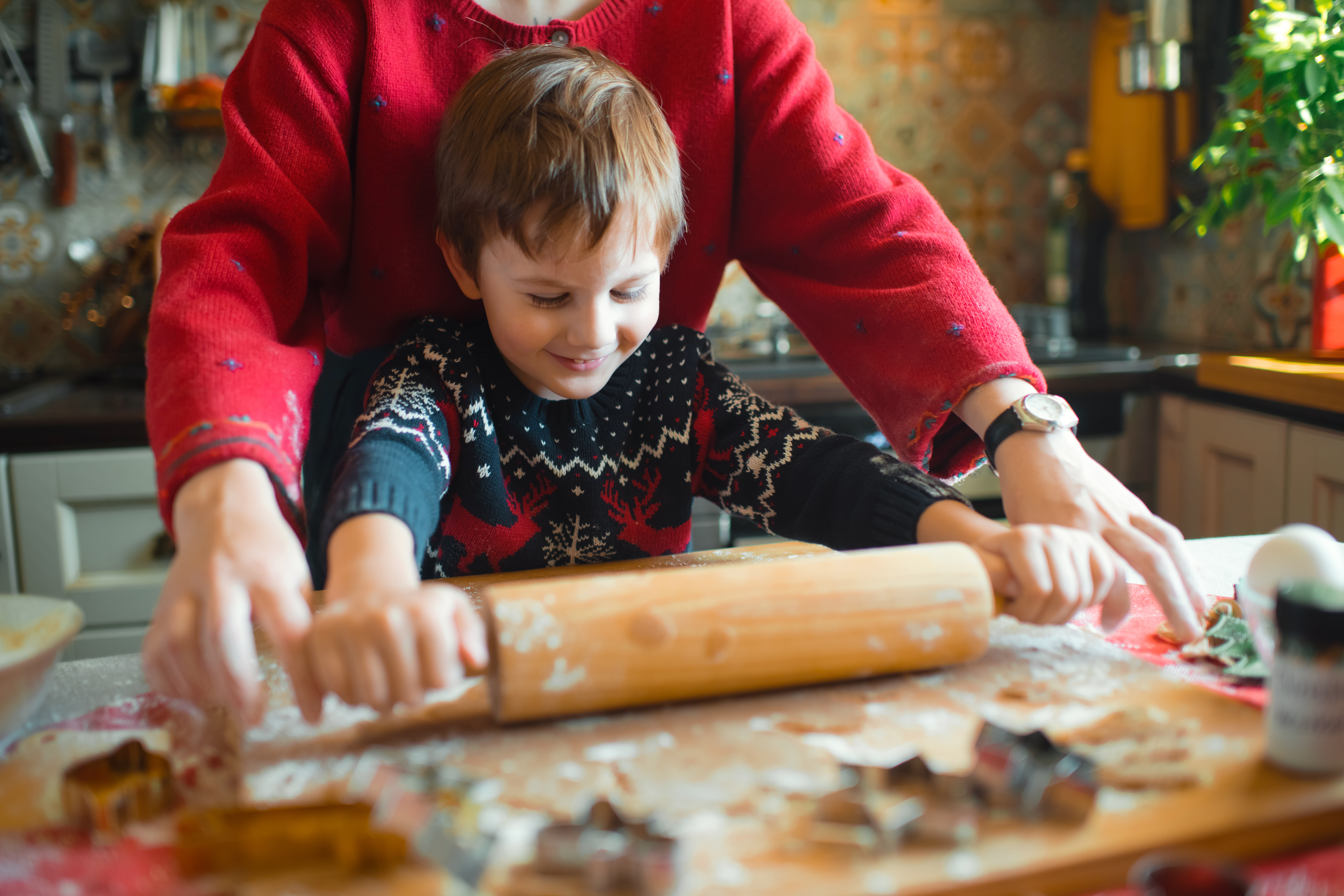 Parent and child making cookies