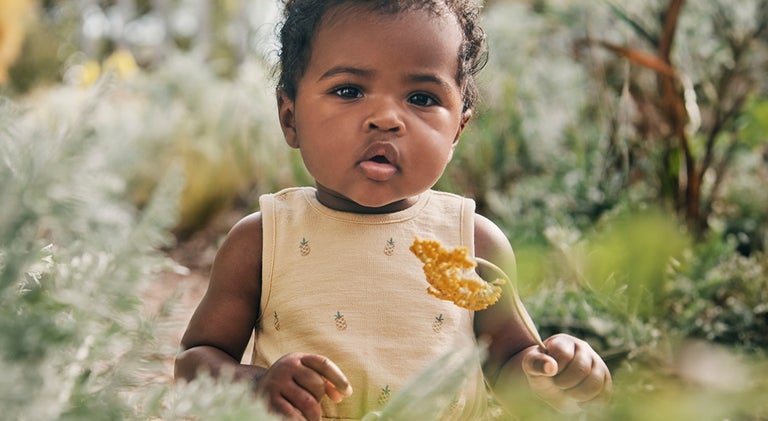 baby with flowers