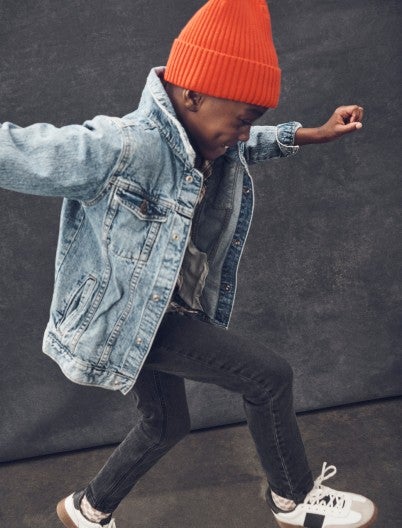 boy jumping in tapered jeans