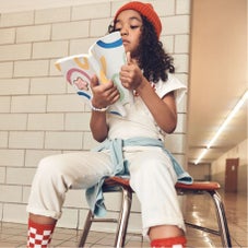 Girl reading in chair