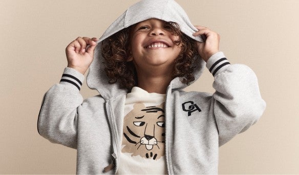 boy with hoodie over head