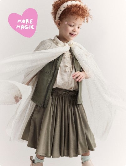 girl with cape and twirl skirt on