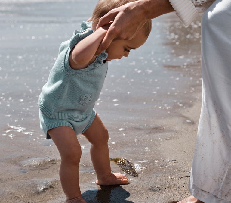 baby playing in the water