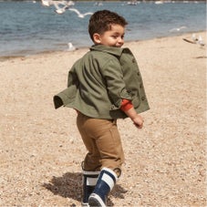 boy in olive shirt, brown pants and carter's boots