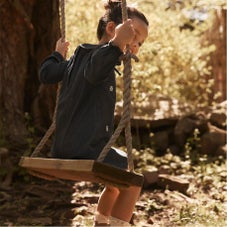 toddler girl on swing
