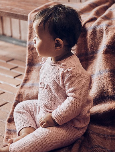 baby in pink sweater