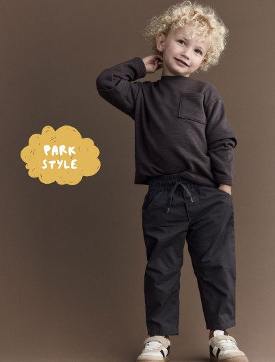 Toddler boy dressed in charcoal pocket tee and city joggers