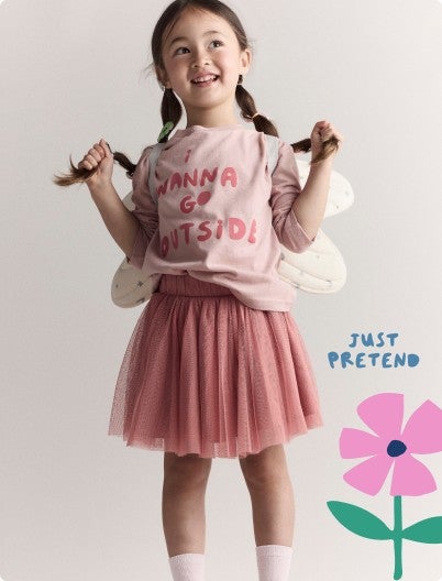 girl with butterfly wings and shirt that says "I want to go outside"