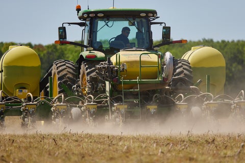 John Deere planter in-field equipped with liquid tanks and PumpStack.