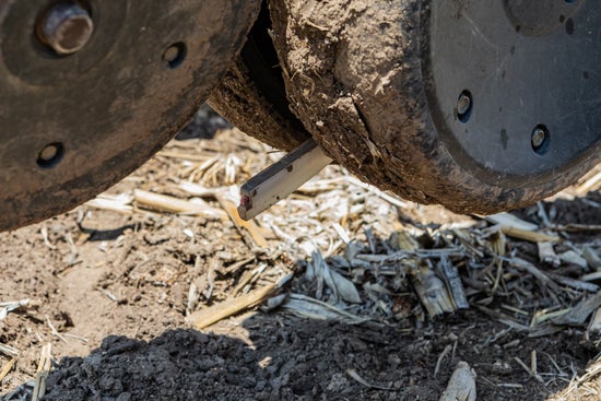 Close-up of a Keeton Seed Firmer during planting