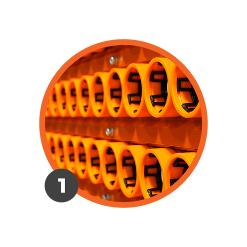 Orange GeoTubes in two rows loaded in a Radicle Lab.