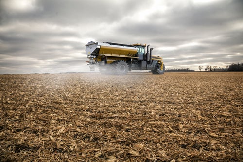 Terragator dry fertilizer spreader broadcasting fertilizer