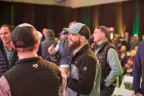 Farmers talking at Precision Planting Winter Conference