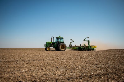 John Deere 4250 tractor pulling an 8-row planter. 