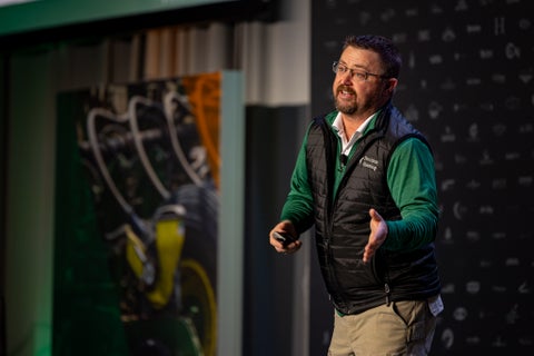 Speaker at Precision Planting Winter Conference on stage Jason Webster