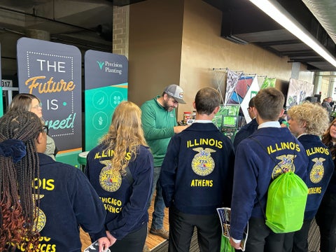 Students at Precision Planting booth at FFA Convention