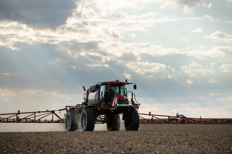 Case IH sprayer in a field with Precision Planting's ReClaim module