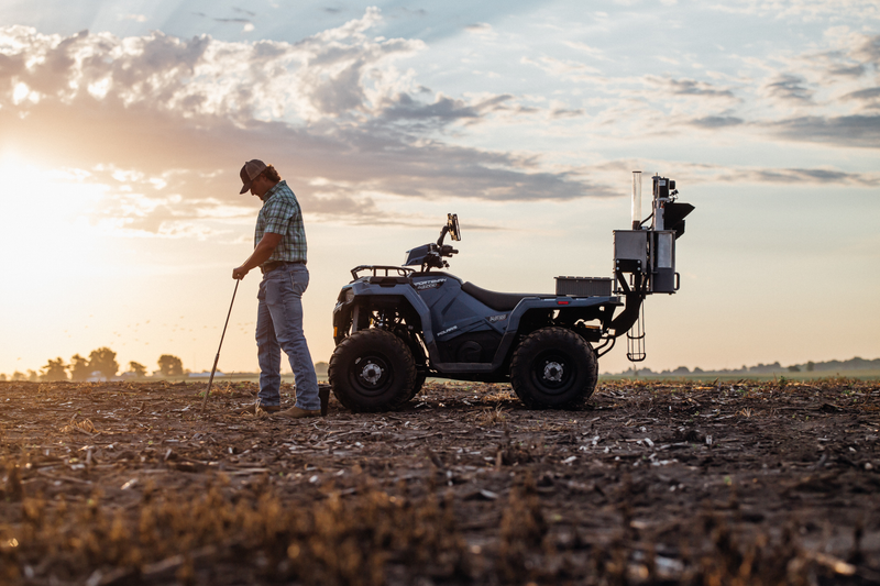 Agronomist using ATV-mounted GeoPress™ automated soil sample tagging in the field