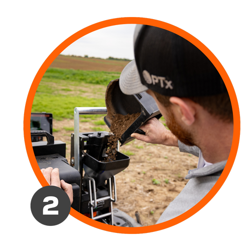 A farmer dumps soil into GeoPress Lite