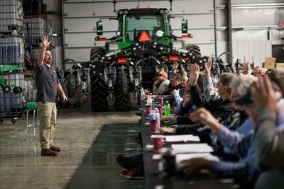 Farmers learning at educational event from Precision Planting