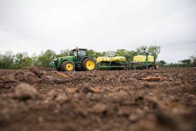 John Deere planter upgraded with Precision Planting Conceal banded fertilizer gauge wheels.