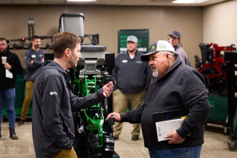 Jason Stoller talking with a farmer about CornerStone at Winter Conference.