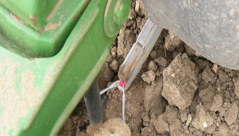 A  close-up view of the Keeton Seed Firmer applying liquid application.