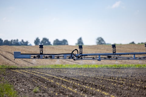 SymphonyVision system on sprayer boom applying to emerged crop.