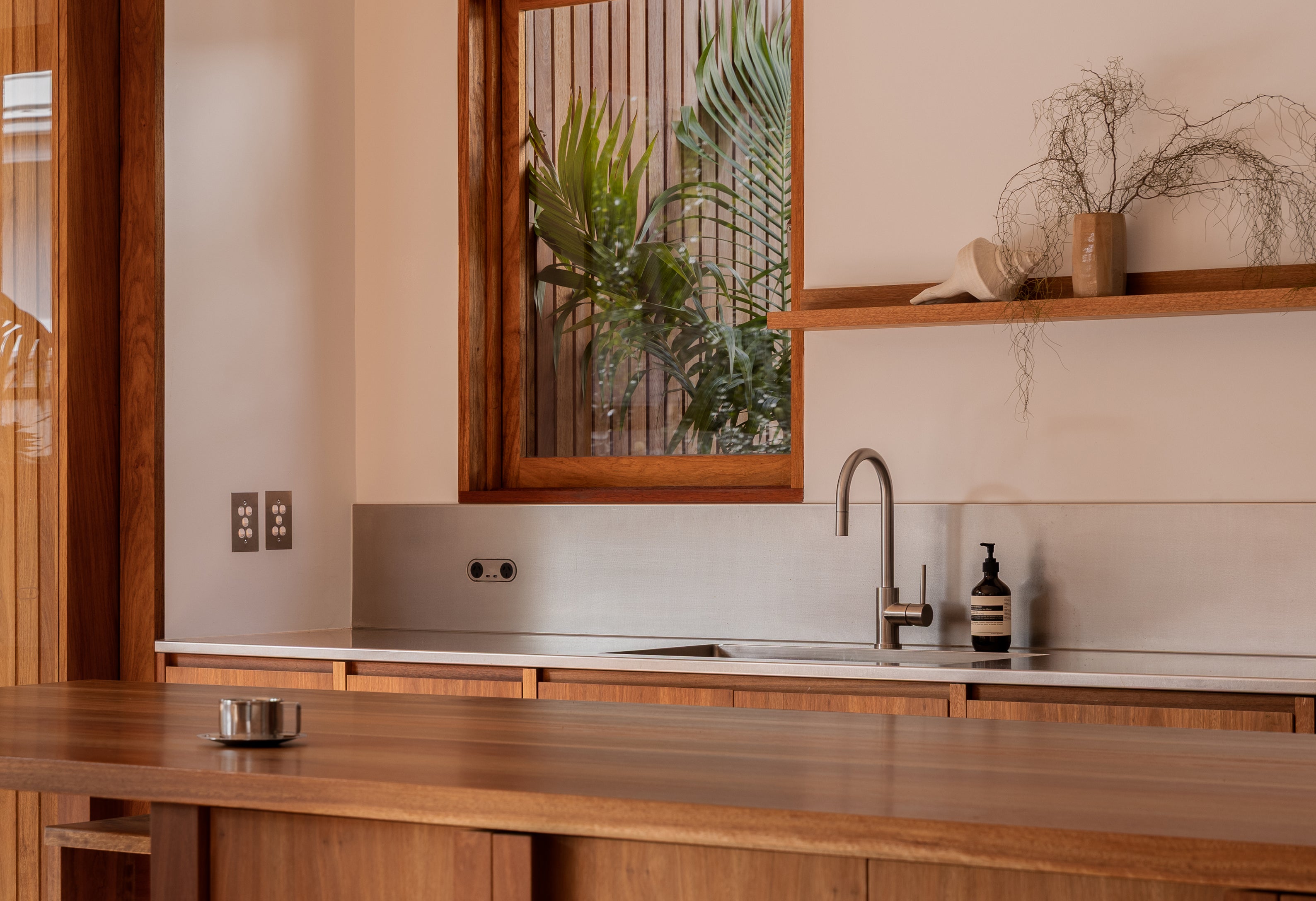 Modern kitchen interior with warm timber details