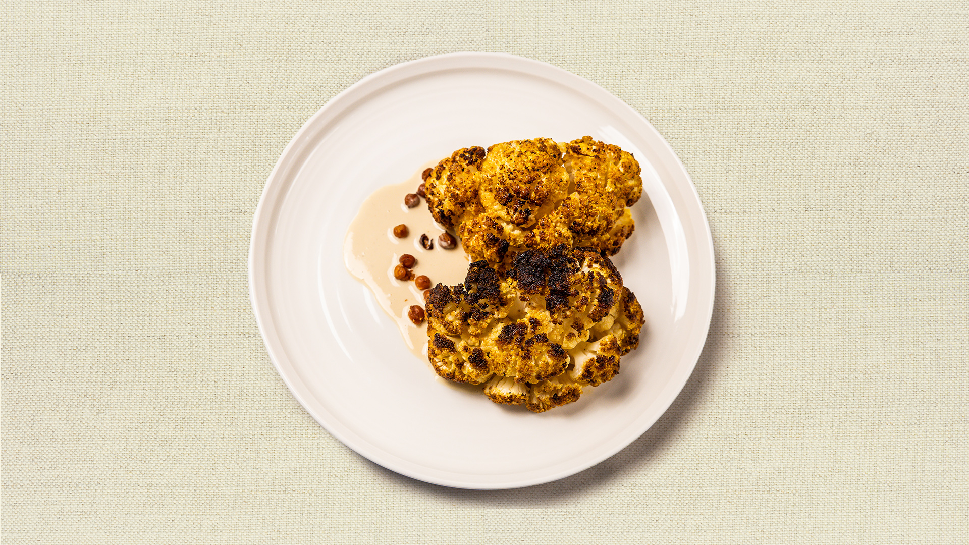 Roasted Cauliflower (gf) - Glazed, roasted cauliflower steaks, served with a side of creamy garbanzo tahini sauce. (12-14 oz, gluten free, vegan, serves 2-3)