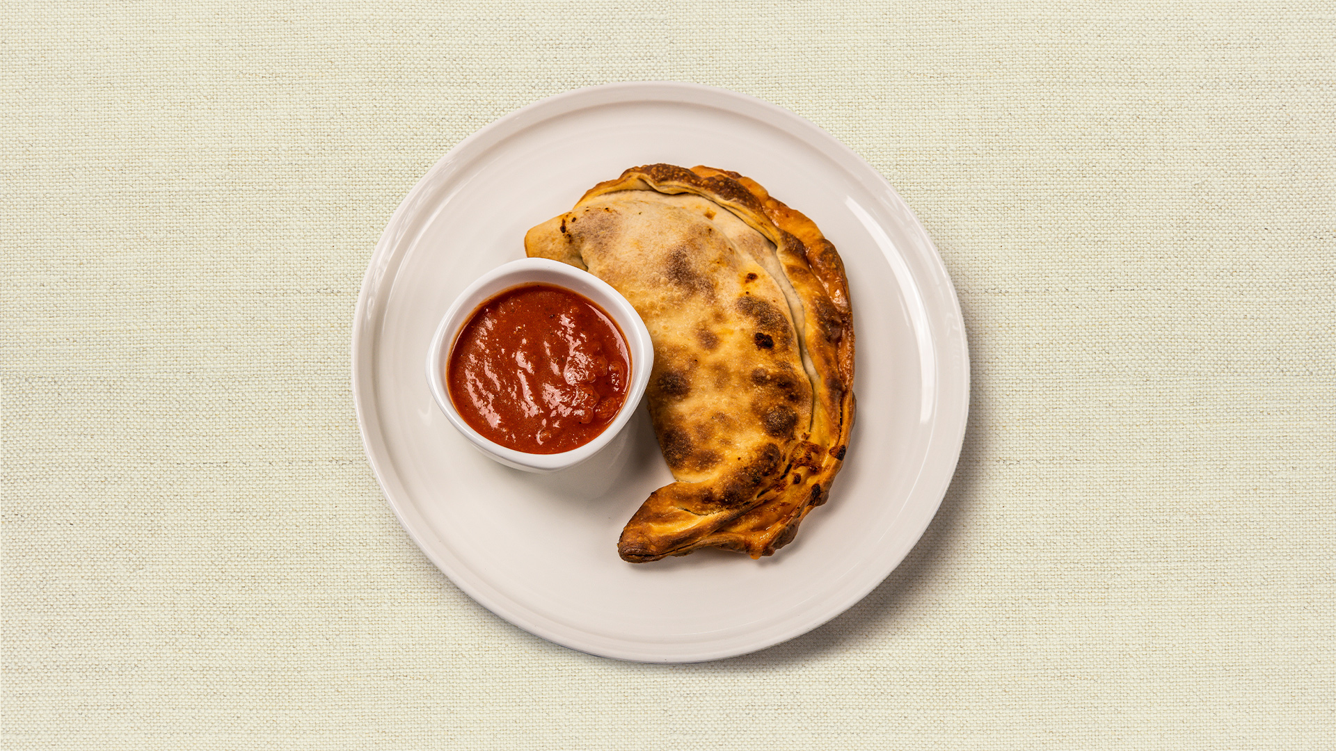 Pocket Pizza - Cheese or pepperoni with your choice of sauce - our chef recommends mama’s marinara. (8 oz, serves 1)