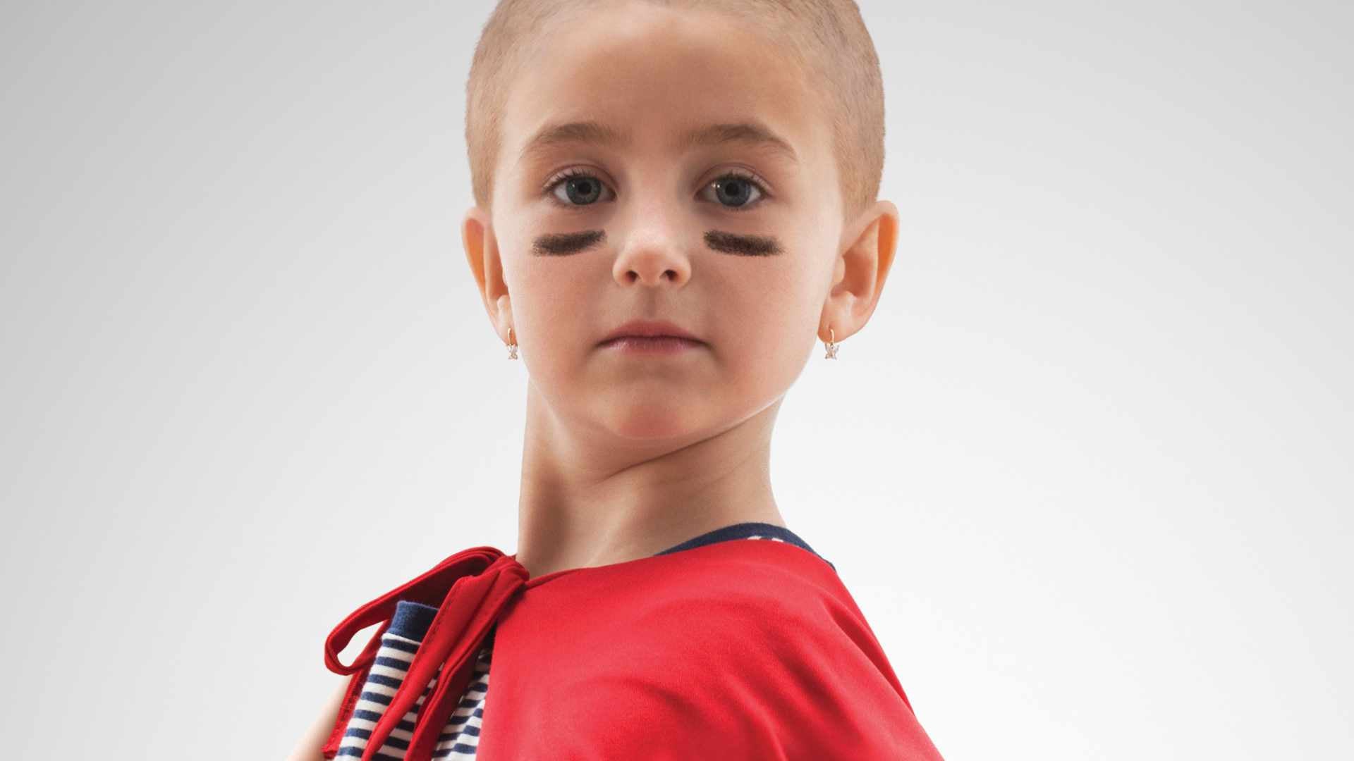 Photo of a child wearing eye black