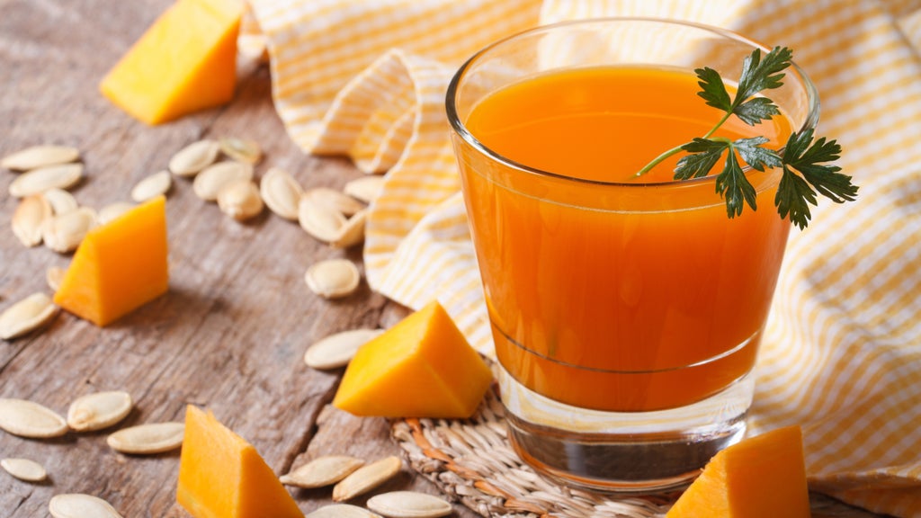 pumpkin juice with pumpkin pieces and pumpkin seeds