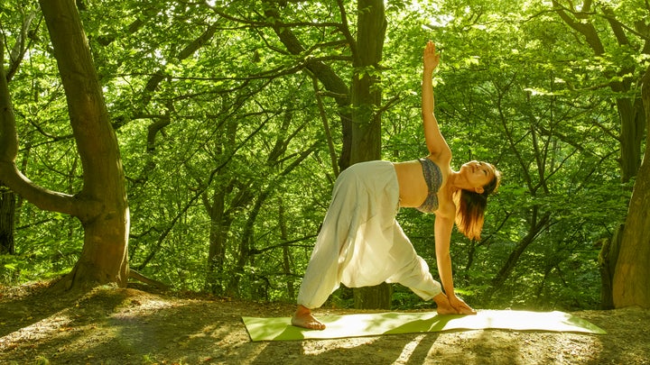 woman doing yoga in the nature