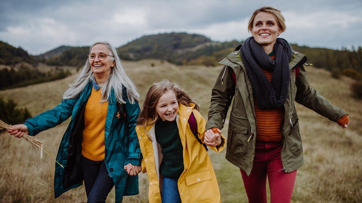 a girl hiking with her mother and her grandmother