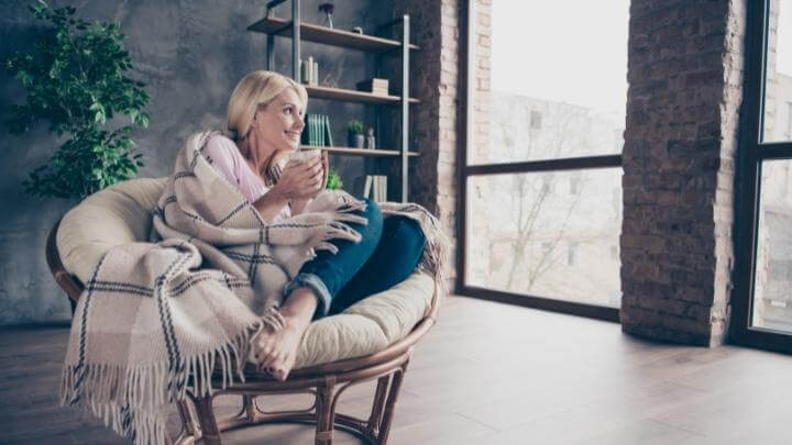 A woman enjoying a cup of earl grey tea at home in the afternoon