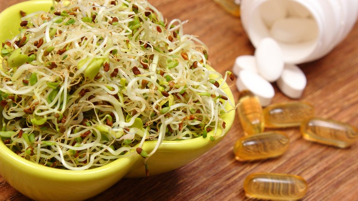 sprouts and supplement pills and capsules