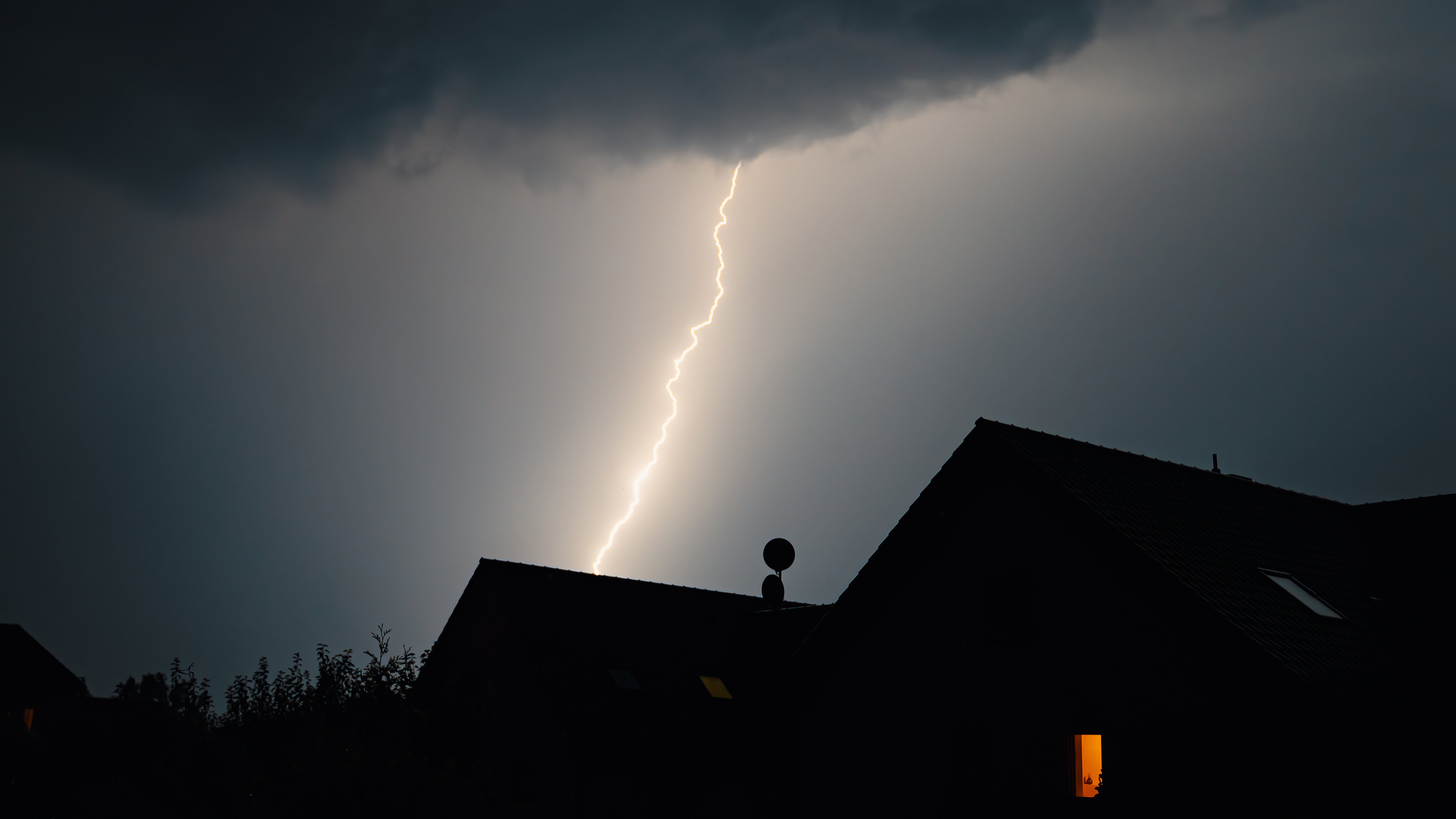 lightening striking a house