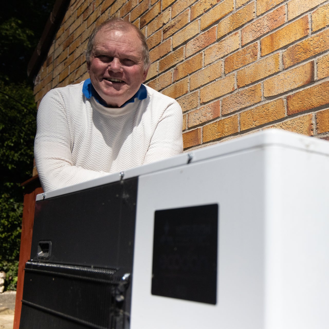 A resident happy with a heat pump install