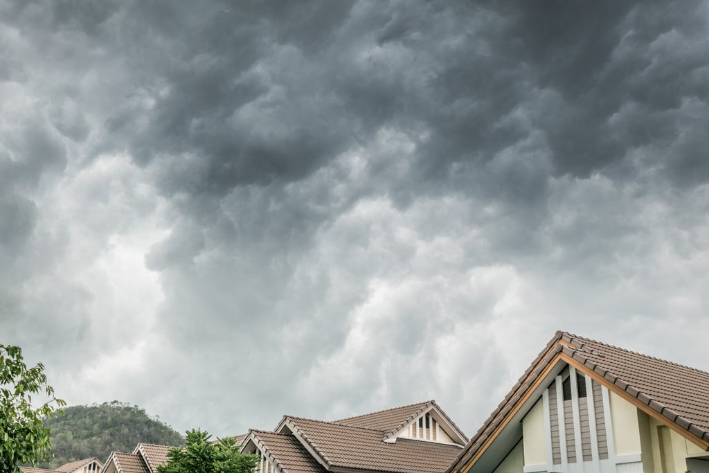 hail storm looming over a house