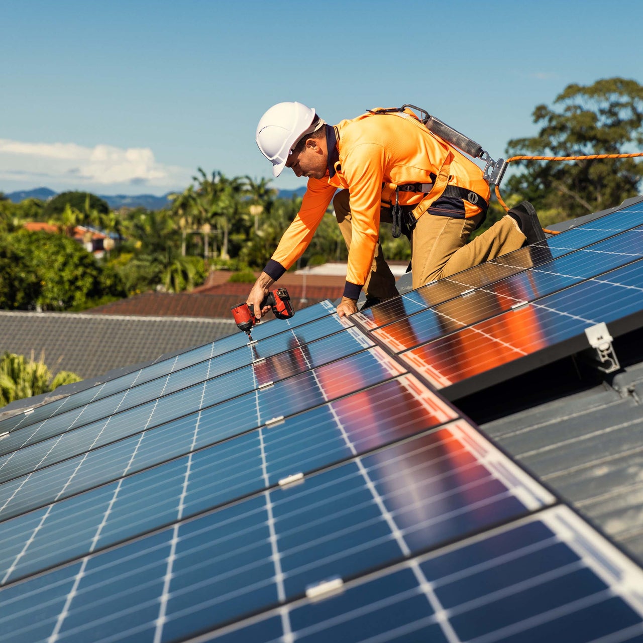Building with solar panels on its roof, suggesting the use of energy modeling for optimizing solar energy efficiency