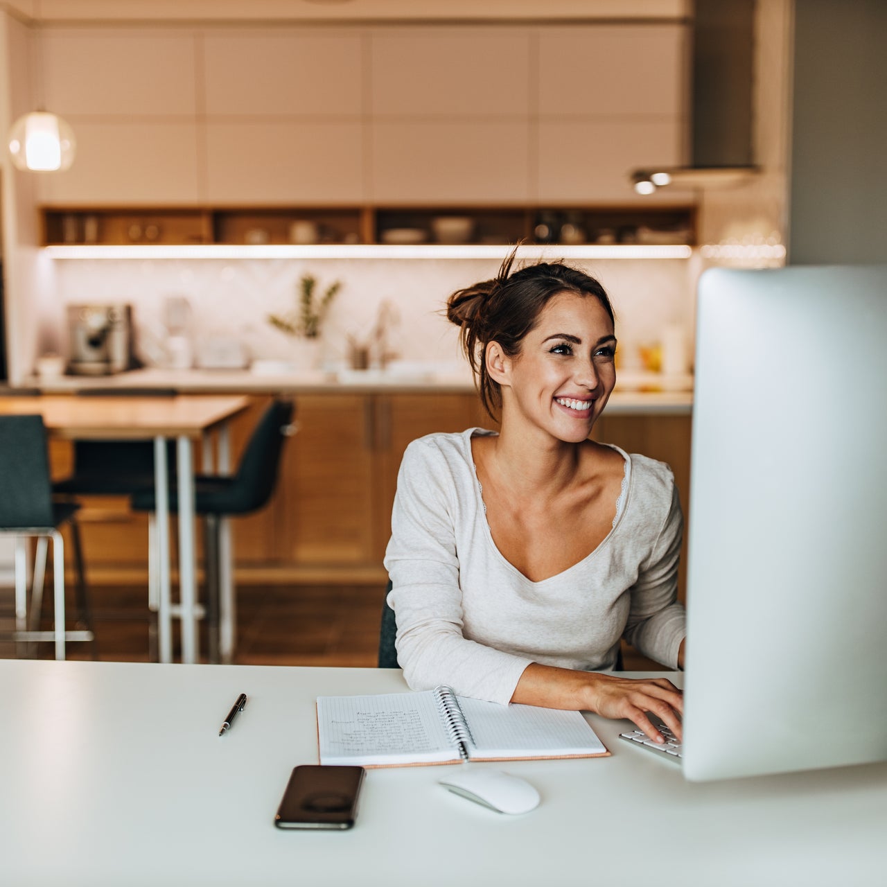 A woman who is seemingly using her computer to track her home value