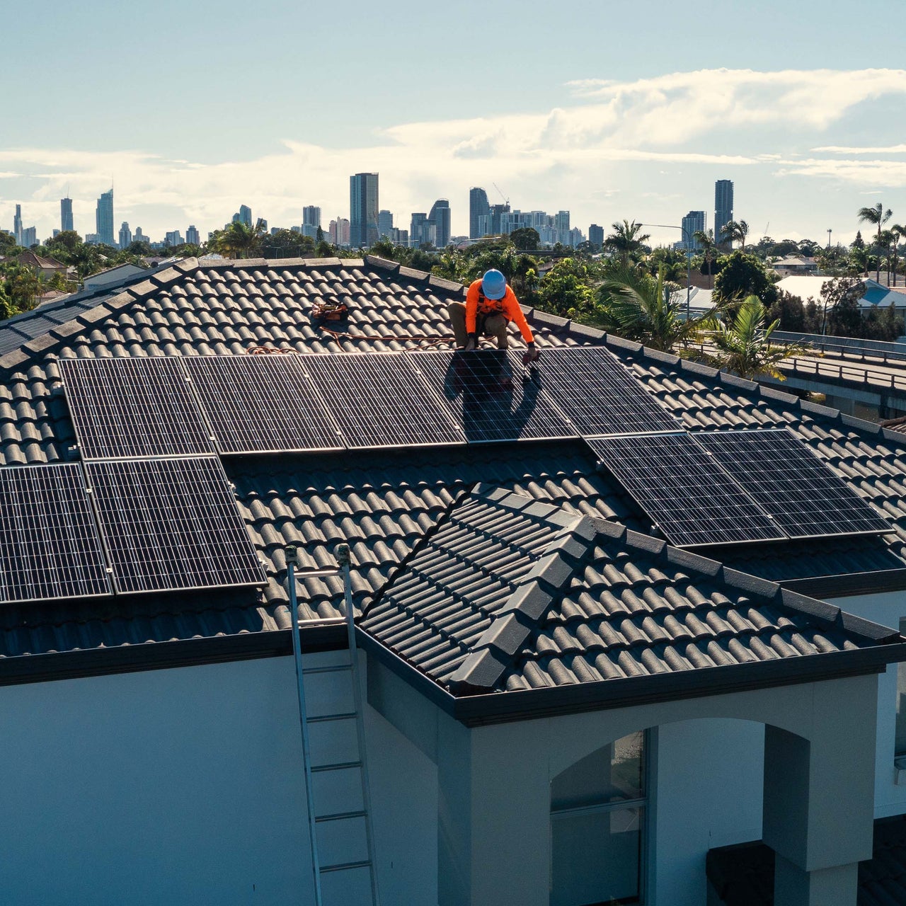 Building with solar panels on its roof, suggesting the use of energy modeling for optimizing solar energy efficiency