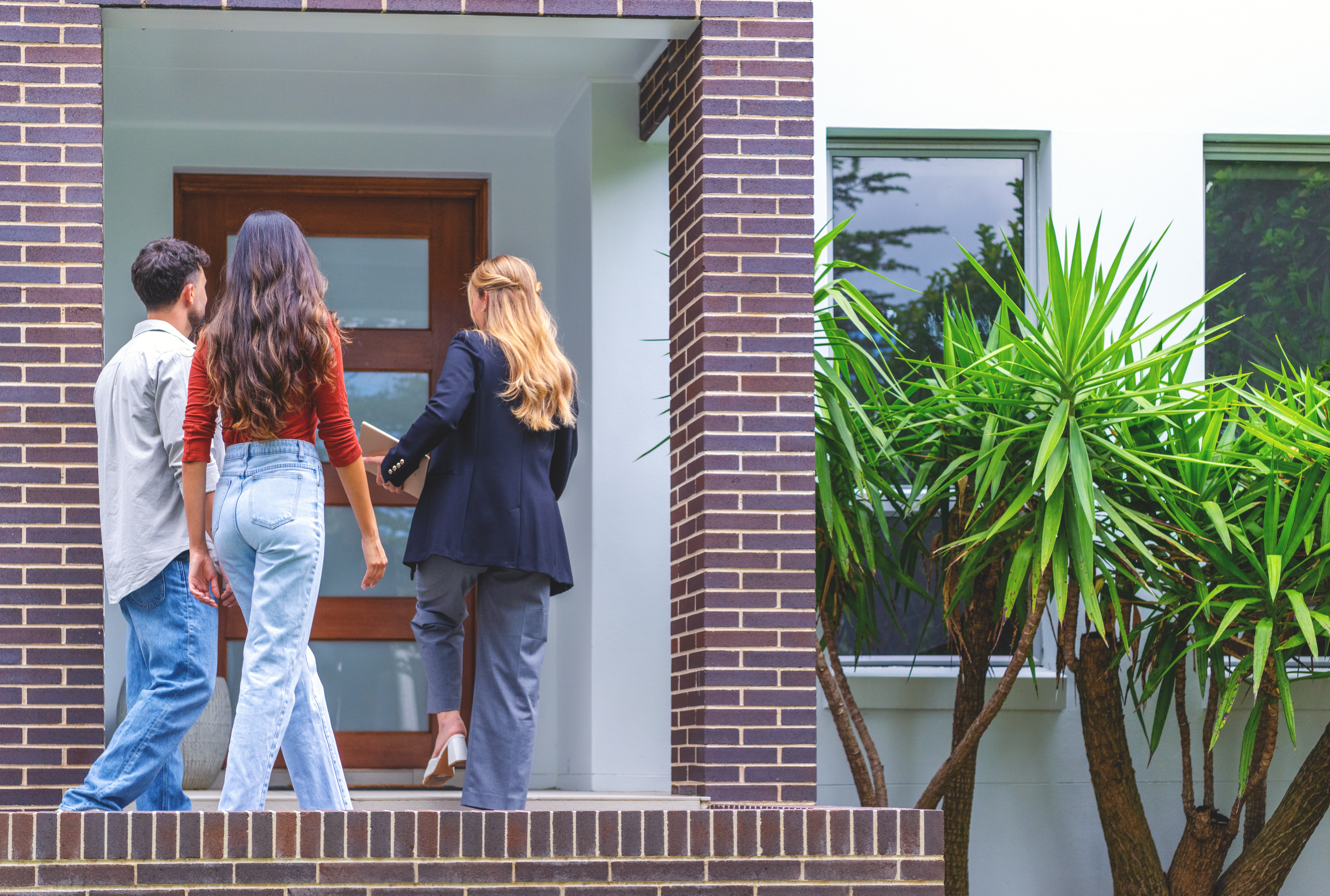 Young couple touring a new home
