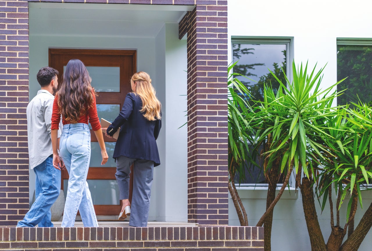 Young couple touring a new home