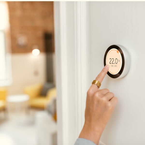 Hand changing the indoor temperature